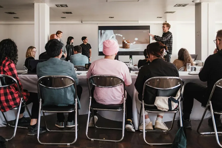 Louisa Savva presenting to a room of participants